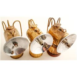 Three Brass Justrite Lamps