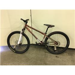 GREEN AND PURPLE KONA DOWNSIDE FRONT SUSPENSION MOUNTAIN BIKE WITH FRONT DISK BRAKE