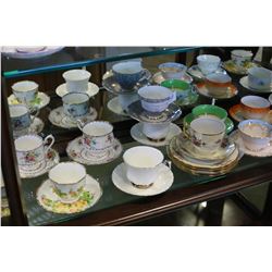 SHELF LOT OF CHINA CUPS AND SAUCERS