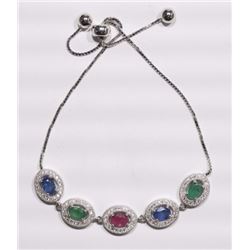 BRACELET - 1.8CTW OVAL FACETED EMERALDS(2), RUBY(1) & SAPPHIRES(2) & 100 ROUND FACETED WHITE STONES 