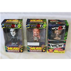 THREE WRESTLING FIGURES