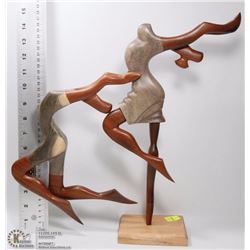 TWO HAND CARVED DANCERS ON DISPLAY