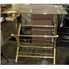 Image 1 : BRASS AND GLASS MAGAZINE TABLE