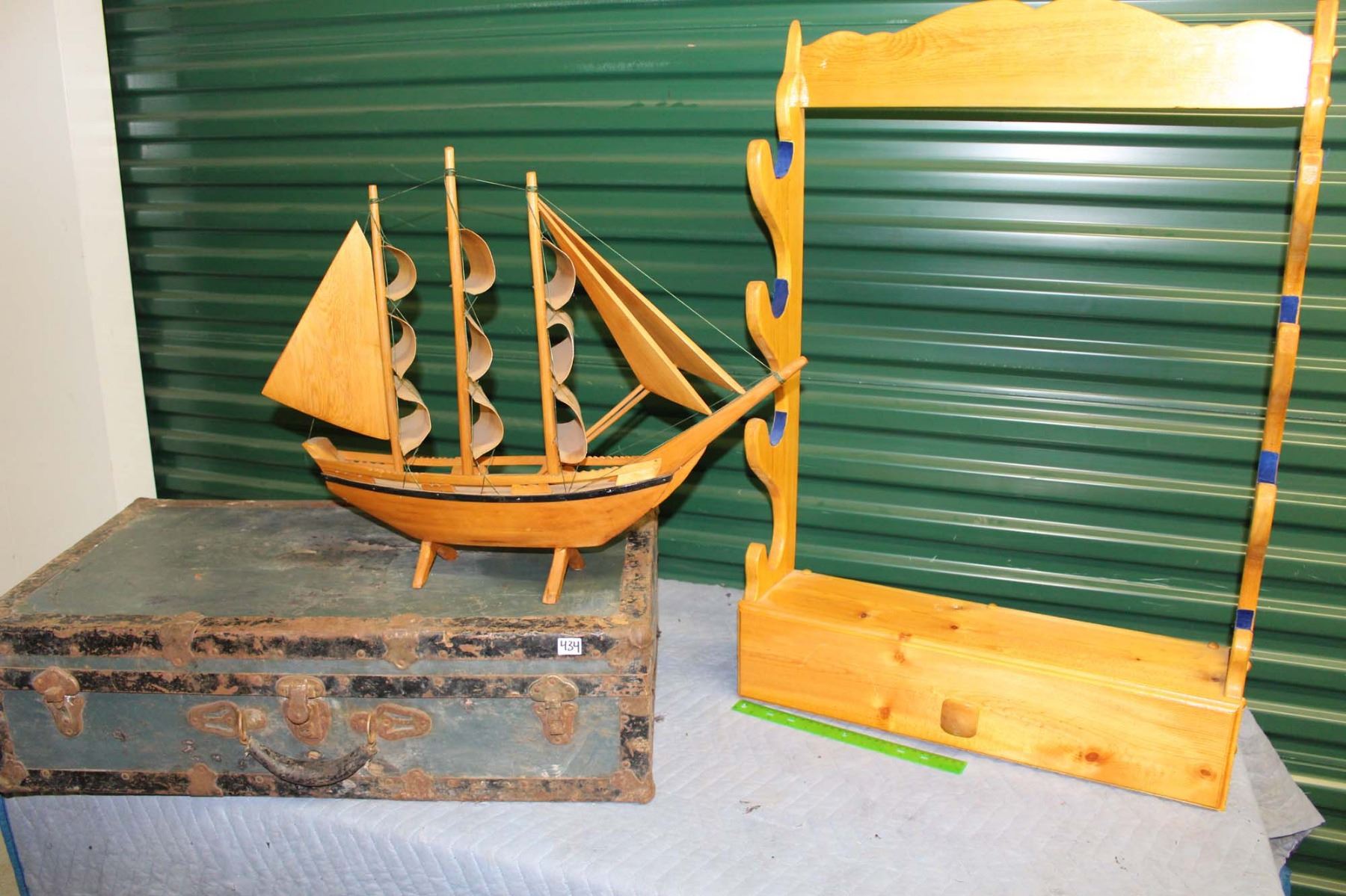 Gun Rack (24”x37”), Wooden Boat (25” Long) & Metal Trunk (30”x17”x9”)