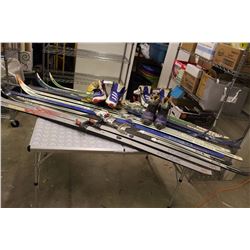 Lot Of Vintage Skiies And Ski Boots