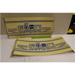 General Motor Expo 86’ “It’s Happening” Plastic Signs (2)(29”x12”)