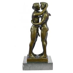 Two Gay Men Engaging In A Flirtatious Kiss Statue