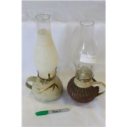 TWO POTTERY OIL LAMPS