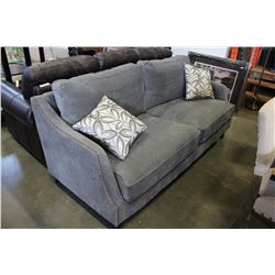 NEW FLOOR MODEL MAZZIN HOME ELEGANCE SOFT GREY FABRIC WITH STUDDED BRASS ACCENT AND THROW PILLOWS