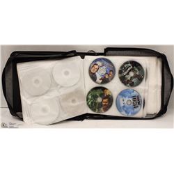 BINDER OF OVER 100 VARIOUS DVDS. BINDER CAN HOLD