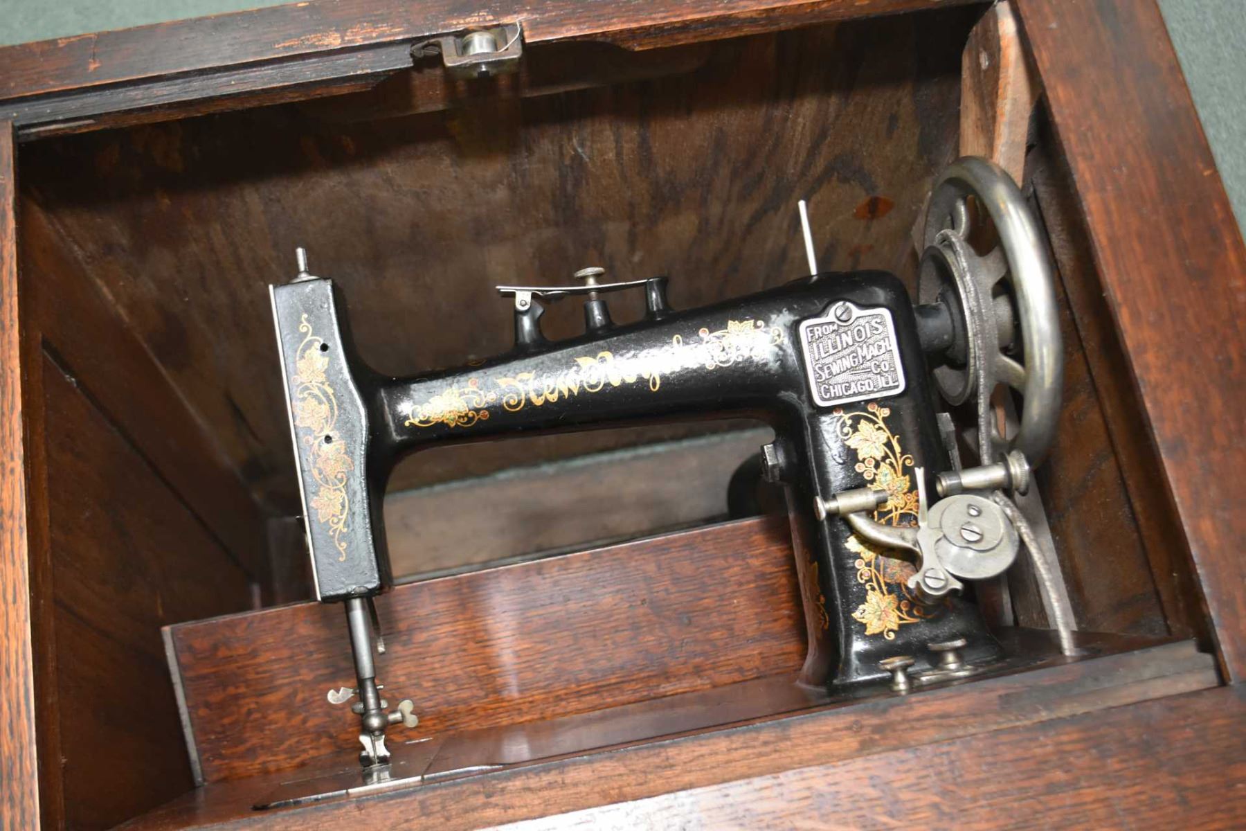 New Royal treadle sewing machine in fully enclosed quarter cut oak
