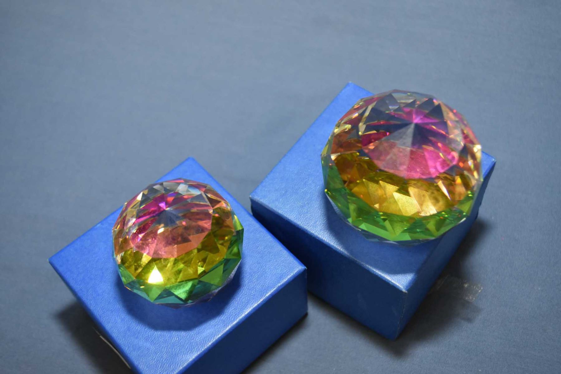 Two Swarovski crystal prisms, one 2 1/4" diameter and one 2" diameter