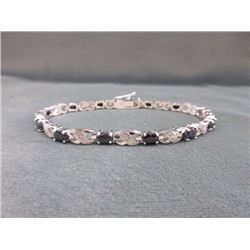 BRACELET - 7.2 CTW OVAL FACETED SAPPHIRE (12) & DIAMOND IN STERLING SILVER CROSS OVER DESIGNED SETTI