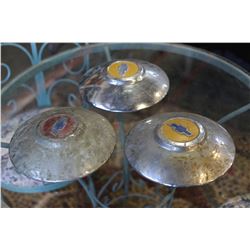 THREE VINTAGE CHEVY HUBCAPS