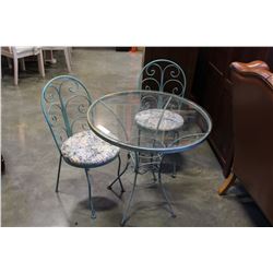 WROUGHT IRON GLASS TOP PATIO TABLE AND THREE CHAIRS