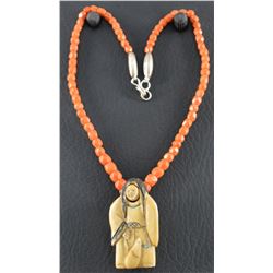 CORAL NECKLACE WITH CARVED PENDANT