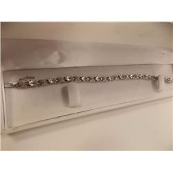 BRACELET - 12  OVAL FACETTED WHITE TOPAZ & DIAMONDS IN STERLING SILVER INFINITY LINK SETTING - ESTIM