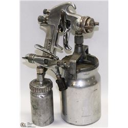 SMALL AND LARGE DEVILBISS PAINT GUNS