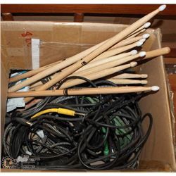 BOX WITH DRUM STICKS CORDS AND MORE
