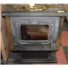 Image 1 : OSBORN CAST IRON WOOD BURNING STOVE