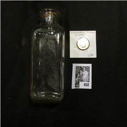 Clear Glass Pharmaceutical bottle without cork; & ca. 1880 Nickelodean Indian design Token.