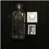 Image 1 : Clear Glass Pharmaceutical bottle without cork; & ca. 1880 Nickelodean Indian design Token.