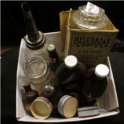 Several old bottles including an antique one Quart Oil bottle.