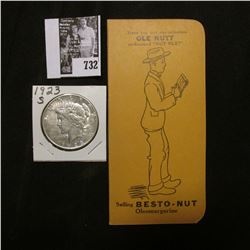 1923 S U.S. Peace Silver Dollar, EF; & a booklet "Have you met our salesman Ole Nutt nicknamed "Nut 