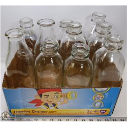 DOZEN OLD MILK BOTTLES