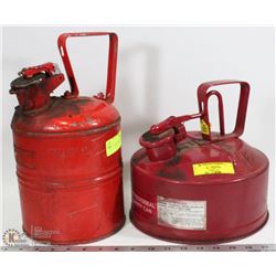A PAIR OF RED VINTAGE GAS CANS
