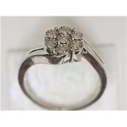 RING - 7 ROUND FACETED DIAMONDS IN STERLING SILVER FLOWER DESIGNED SETTING - RETAIL ESTIMATE $400
