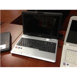 GREY TOSHIBA NOTEBOOK COMPUTER, COMES WITH POWER SUPPLY, NO HARD DRIVE, CONDITION UNKNOWN