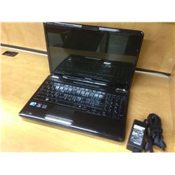 BLACK TOSHIBA NOTEBOOK COMPUTER, COMES WITH POWER SUPPLY, NO HARD DRIVE, CONDITION UNKNOWN