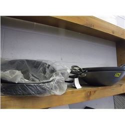 SHELF OF FRYPANS AND WOKS