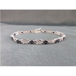 BRACELET - 7.2 CTW OVAL FACETED SAPPHIRE (12) & DIAMOND IN STERLING SILVER CROSS OVER DESIGNED SETTI