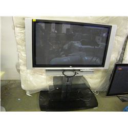 LG TV WITH REMOTE & 3 TIERED BLACK GLASS PANEL TV STAND