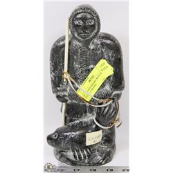 10" SIGNED ESKIMO WITH SEAL STONE CARVING
