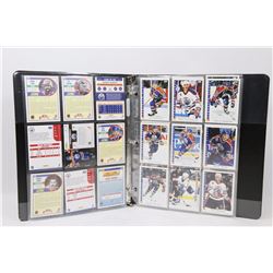 BINDER WITH 4 SHEETS OF OILERS HOCKEY CARDS