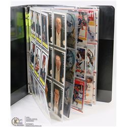 BINDER WITH 4 SHEETS OF OILERS HOCKEY CARDS