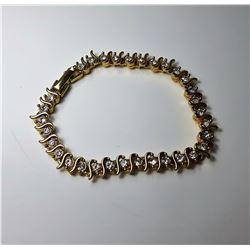 #6 - GOLD TONE & WHITE TOPAZ TENNIS BRACELET