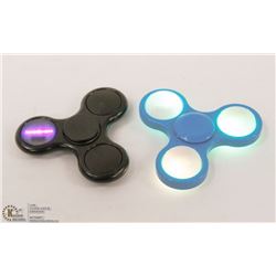 LOT OF TWO  LED LIGHT HAND SPINNERS