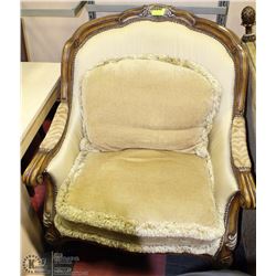 ARM CHAIR WITH CARVED WOOD TRIM AND CUSHIONS