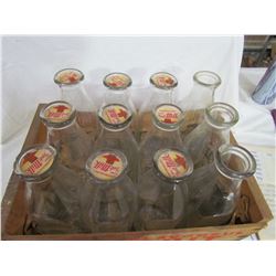 12 Milk bottles in crate - 3 with no lids