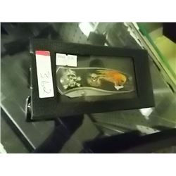 NEW FOLDING KNIFE WITH SKULL IMAGE