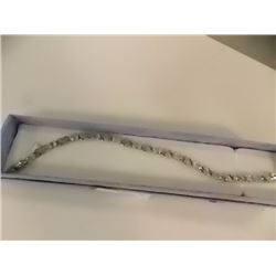 BRACELET - 6CTW OVAL FACETED BLUE TOPAZ (12) & DIAMOND IN STERLING SILVER CROSS OVER DESIGNED SETTIN