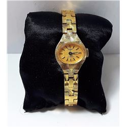 #11 - VINTAGE GOLD TONE TRADITION WATCH