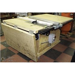 DELTA SHOP SAW WITH FEED TABLE AND CABINET ON