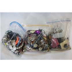THREE ARGE BAGS OF JEWELLRY