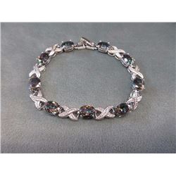 **** FEATURE ITEMS**** BRACELET - 34.5 CTW (9) OVAL FACETED MYSTIC TOPAZ IN STERLING SILVER SETTING 