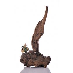 Chinese Mud man and driftwood center piece. The ma